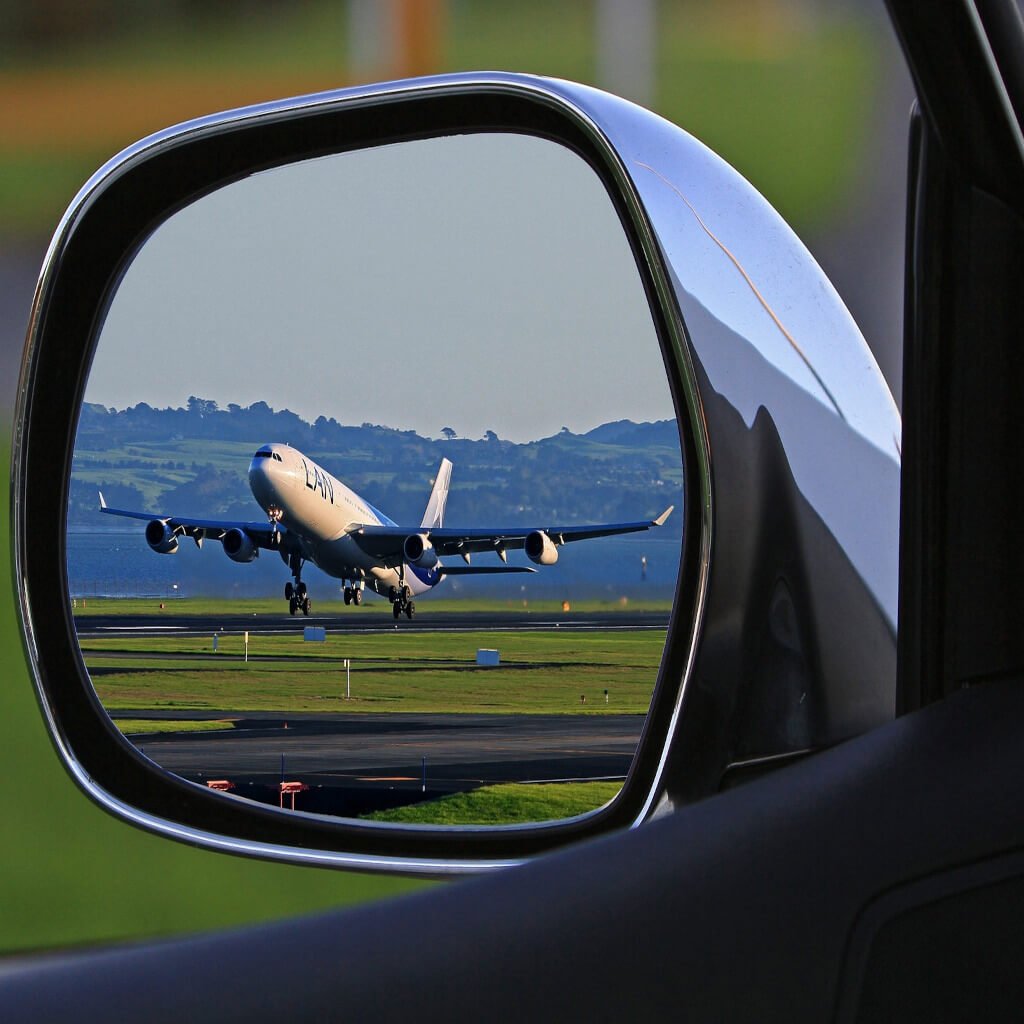 Luxury car and airplane symbolizing seamless airport transfer services in Edinburgh - EdiVentures.